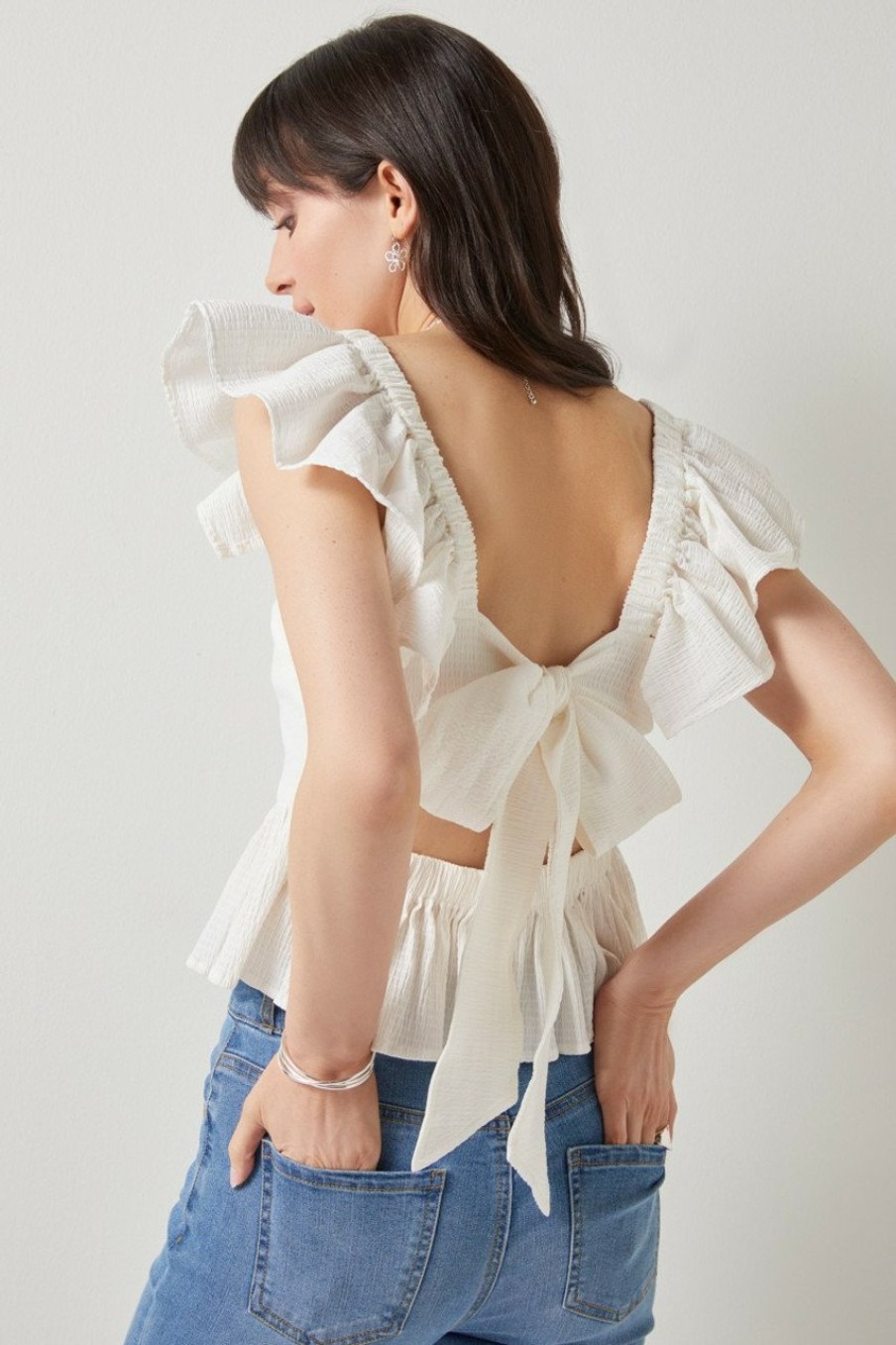 Francesca's Bella Flutter Sleeve Bow Back Top Tops