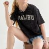 Francesca's Malibu Acid Wash Graphic Tee Black Tops