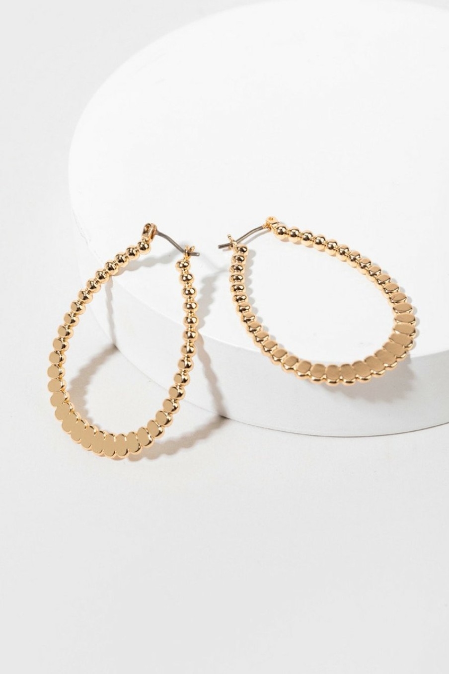 Francesca's Anette Flattened Hoop Earrings Gold Earrings