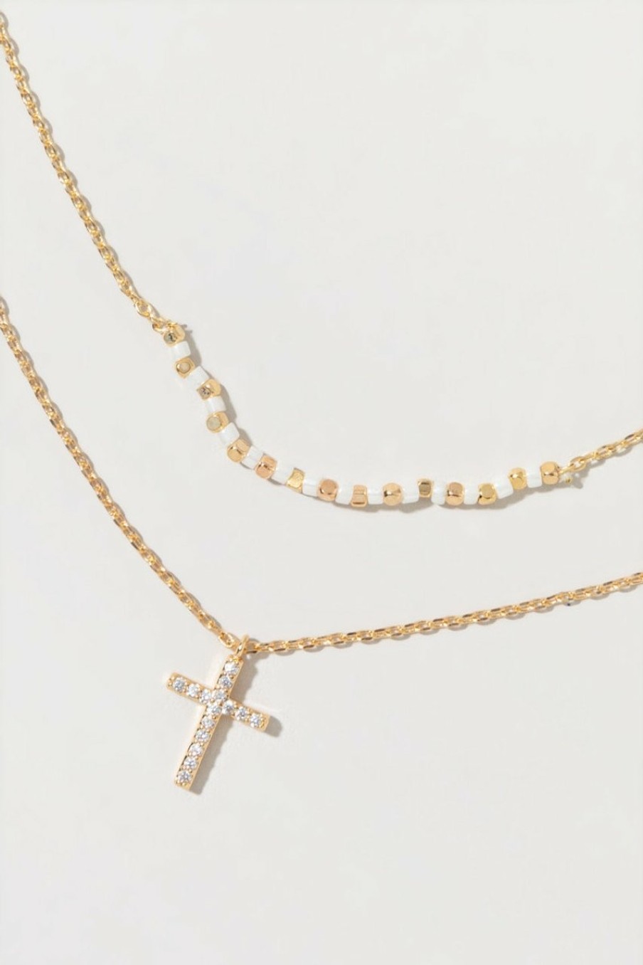 Francesca's Anamaria Dainty Cross Layered Beaded Necklace Ivory Necklaces